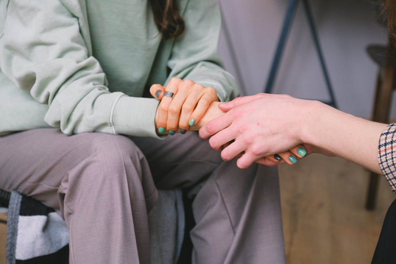 crop-psychologist-supporting-patient-during-counseling-indoors