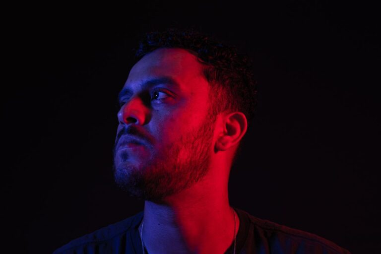 portrait-of-a-man-illuminated-by-red-and-blue-lights